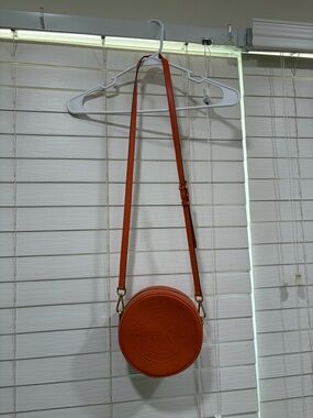 Michael Kors Orange Round Crossbody with Embossed Logo